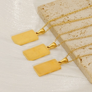 Gold 18K stainless steel zodiac pendant necklace featuring a rabbit on a stone surface