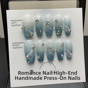 Blue ocean marble press-on nails with silver glitter and rhinestone details