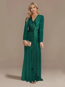 Close-up of emerald green sequin evening gown featuring deep V-neck and twist waist detail