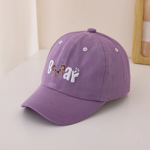 Detailed view of purple kids baseball cap featuring 3D white Bear embroidery with bear ears