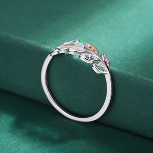 Macro shot of S925 silver olive branch ring with colorful zircon stones and side texture