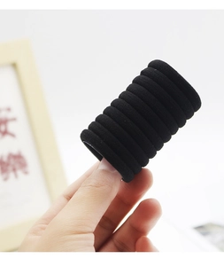 Detailed close-up showing the seamless texture and high elasticity of black hair ties