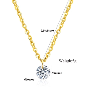 Detail showing 6mm round zircon pendant on a gold chain necklace with 45cm length