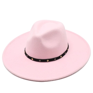 Detail of pink wool felt jazz hat featuring black leather band with metallic rivets