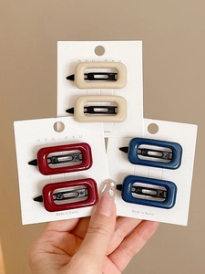 Set of minimalist pink beige, red and navy rectangular hair clips on display card