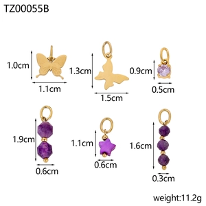 Detail of purple bead set and golden butterfly charms with size measurements and weight
