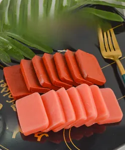 Macro shot of realistic fake duck blood and luncheon meat slices on a black plate
