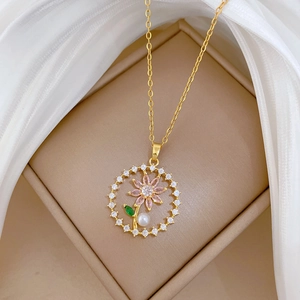 Titanium steel necklace with floral pearl pendant and pink crystals in a jewelry box