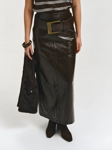 Close-up of a high-waisted dark brown faux leather long skirt with a matching wide belt