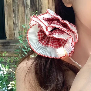 Close-up of red and white checkered double-layer lace scrunchie on a ponytail