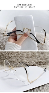 Detail of round gold metal frame anti-blue light glasses with adjustable nose pads