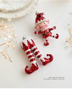 Detail of red and white elf Christmas tree hanging ornaments with snowy glitter finish