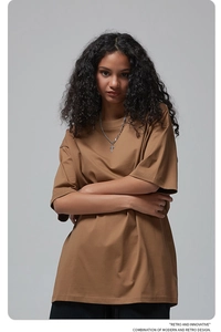 Detail of oversized cotton T-shirt featuring dropped shoulders and premium fabric texture