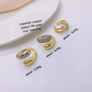 Macro shot of 18k gold plated horseshoe buckle rings with cubic zirconia details