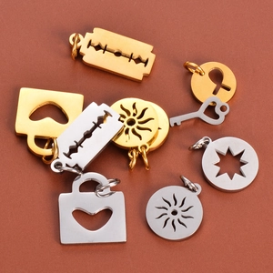 Detailed macro view of mixed gold and silver polished celestial and lock metal charms