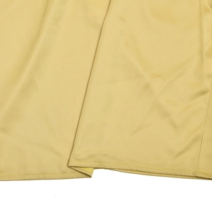 Macro shot of yellow satin fabric texture and high-quality hem stitching details