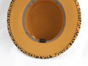 Detail of wool fedora interior showing leopard print brim and adjustable strap
