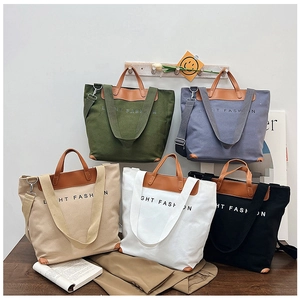 Detailed display of casual canvas tote bags in five colors with leather handles