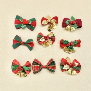 Detailed set of nine festive Christmas bows with bells and berries on a beige background