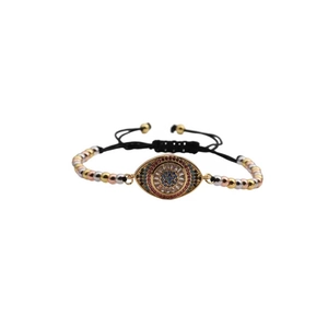 Adjustable evil eye charm bracelet with copper zircon beads and black woven cord