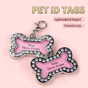 Pink bone-shaped dog tag with sparkling rhinestones and lobster clasp for pet collars