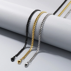Detailed shot of classic Cuban link necklaces in black, gold, and silver stainless steel