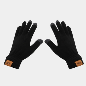 Close-up of black touchscreen knit gloves with MOM leather patch and gray finger tips