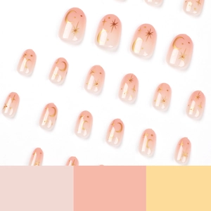 Faux ongles courts ronds dégradés rose avec motifs dorés d'étoiles et de lune chic
