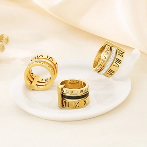 Three-piece gold roman numeral ring set with black enamel and sparkling zircons
