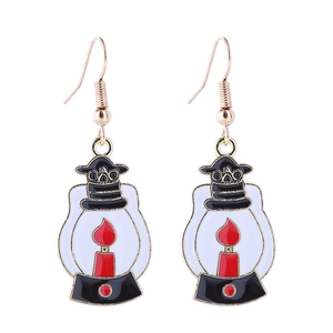 Detailed view of vintage lantern earrings with black frames and vibrant red flame motifs
