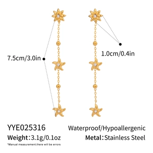 Detail view of gold stainless steel star tassel earrings with dimensions and weight info