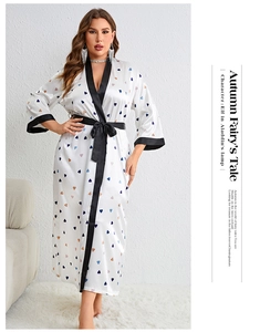 Detail view of white satin plus size robe with heart print and black contrast collar