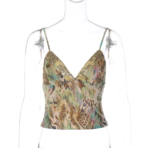 Close-up of leopard print camisole with gold sequin neckline and thin straps