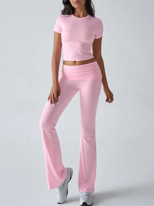 Detail view of pink casual short sleeve top and high-waist flared pants set with soft fabric