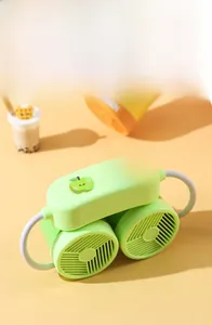 Detail view of portable neck fan with apple pattern and hidden air vents on orange base