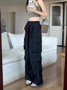 Mirror selfie showing the relaxed fit and drape of these black wide-leg cargo pants