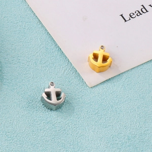 Polished stainless steel anchor pendants with cubic zirconia in gold and silver finish