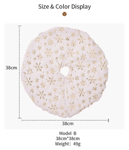 Detailed view of white plush Christmas tree skirt with gold sequin snowflakes, 38cm diameter