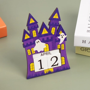 Macro shot of purple wooden Halloween countdown calendar featuring ghosts and castle detail