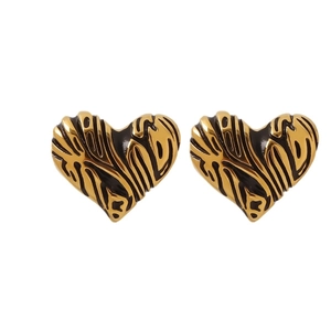 Golden 18K plated heart earrings with black zebra pattern and polished metal finish