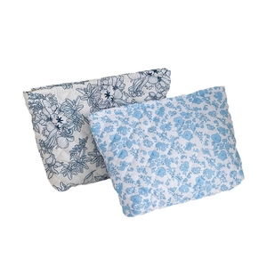 Quilted floral makeup bag set with blue flower patterns in white cotton fabric