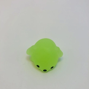 Close-up of a translucent green seal squeeze toy with soft texture and cute black eyes