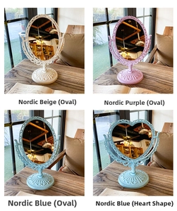 Detail of vintage double-sided vanity mirrors in assorted colors and shapes
