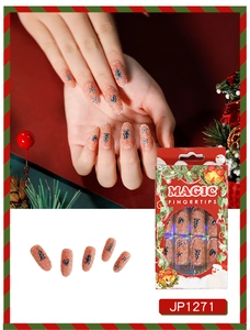 Detailed Christmas themed press on nails with peach base and holiday patterns JP1271