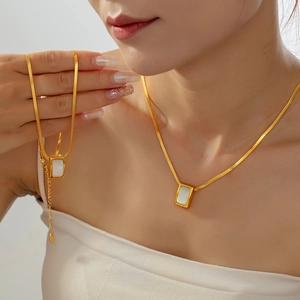 Elegant gold snake chain necklace with a vintage rectangular white shell inlay pendant