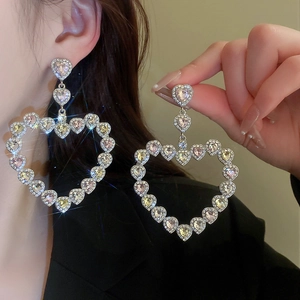 Sparkling oversized silver heart drop earrings with rhinestones for a luxury fashion statement
