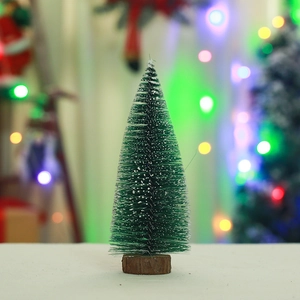 Macro detail of mini snowy Christmas tree with pine needles and round wooden base