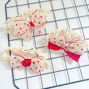 Detailed view of baby lace headbands with red polka dot bows and crown ornament