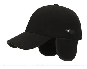 Detail view of winter baseball cap with ear flaps and side metal button accent