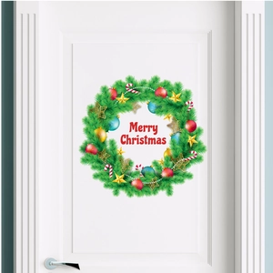 Christmas wreath wall sticker with Merry Christmas greeting on a white bedroom door